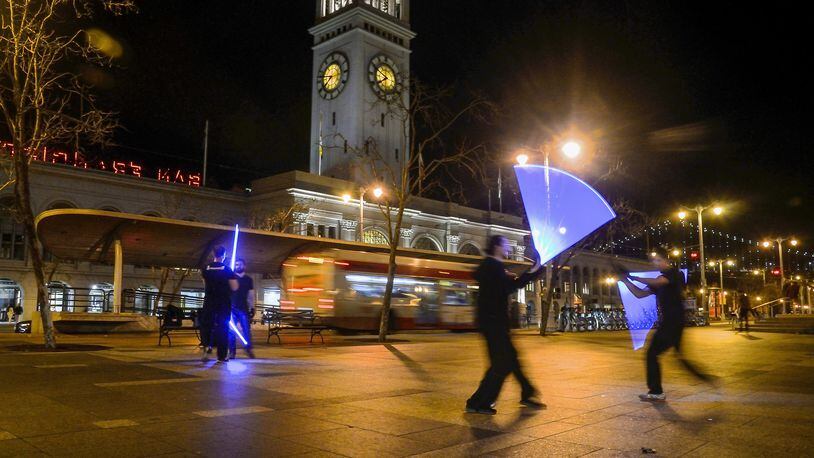 Ludosport light-saber players in front of the Ferry Building, Embarcadero, San Francisco. (Christopher Reynolds/Los Angeles Times/TNS)