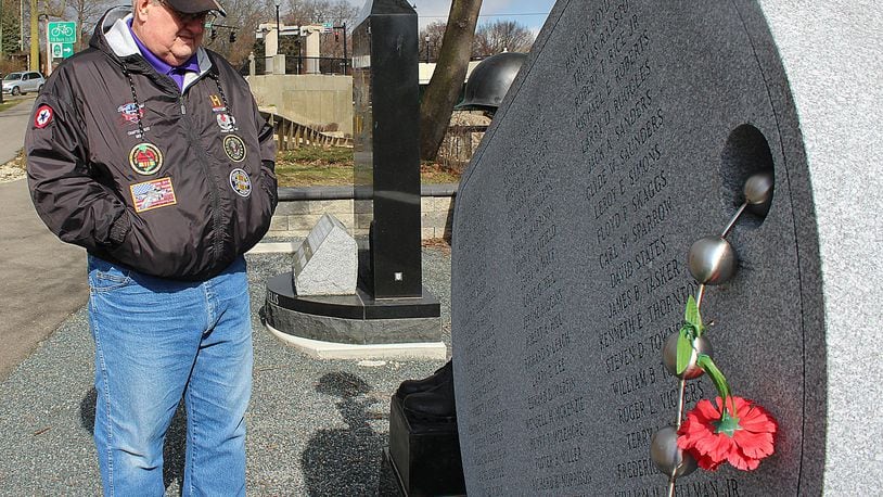 Vietnam veteran Randy Ark looks at a monument honoring all Clark County residents who died in the Vietnam war. JEFF GUERINI/STAFF