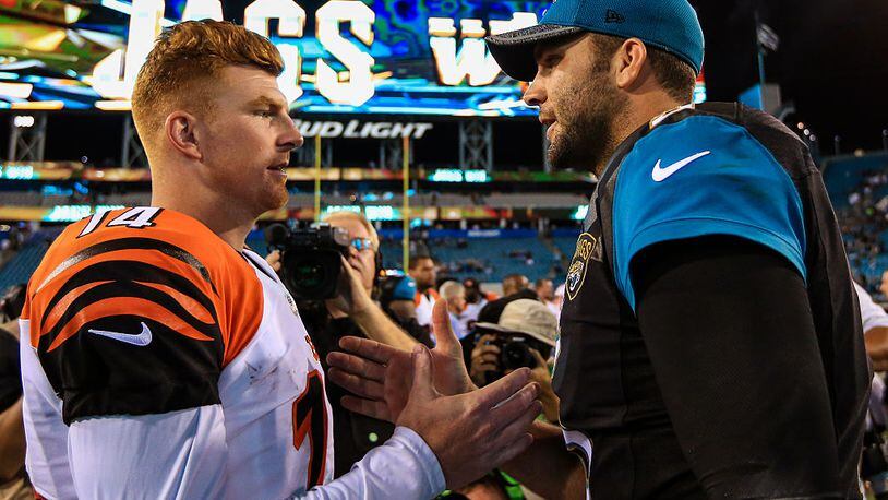 JACKSONVILLE, FL - AUGUST 28: Andy Dalton #14 of the Cincinnati Bengals and Blake Bortles #5 of the Jacksonville Jaguars shake hands after the preseason game at EverBank Field on August 28, 2016 in Jacksonville, Florida. (Photo by Rob Foldy/Getty Images)