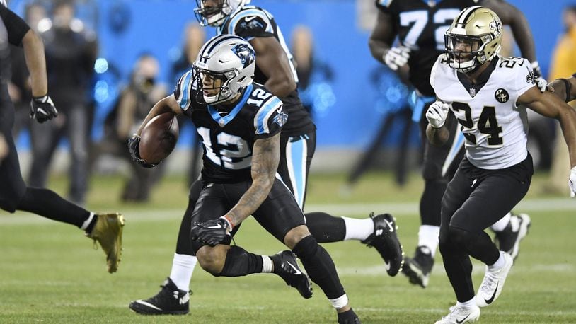 Carolina Panthers wide receiver D.J. Moore (12) runs past New Orleans Saints strong safety Vonn Bell (24) during the second half at Bank of America Stadium in Charlotte, N.C., on Monday, Dec. 17, 2018. The Saints won, 12-9. (David T. Foster III/Charlotte Observer/TNS)