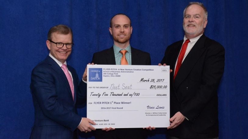 Zach McHale is presented with the top prize of $25,000 in the University of Dayton’s 11th annual Flyer Pitch competition.