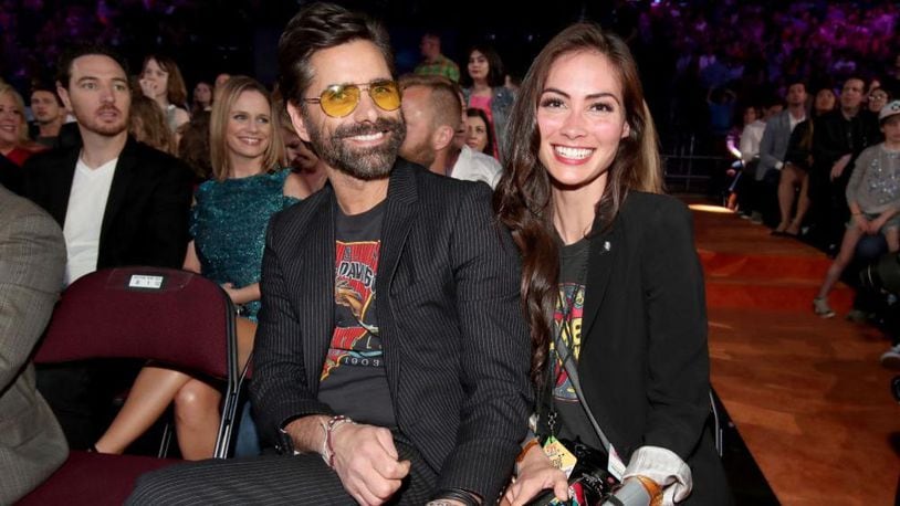 Actor John Stamos (L) and Caitlin McHugh at Nickelodeon's 2017 Kids' Choice Awards at USC Galen Center on March 11, 2017 in Los Angeles, California.  (Photo by Chris Polk/KCA2017/Getty Images for Nickelodeon)