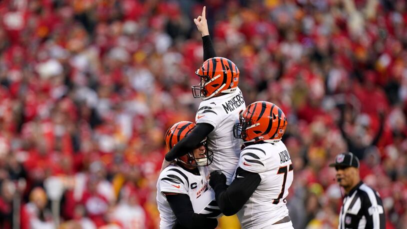 Cincinnati Bengals kicker Evan McPherson (2) celebrates with teammates after kicking a 31-yard field goal during overtime in the AFC championship NFL football game against the Kansas City Chiefs, Sunday, Jan. 30, 2022, in Kansas City, Mo. The Bengals won 27-24. (AP Photo/Eric Gay)