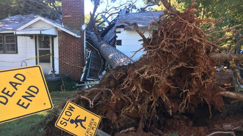 A man saved his sister and nephew after a tree fell and split a house in two. (Photo: WSOCTV.com)