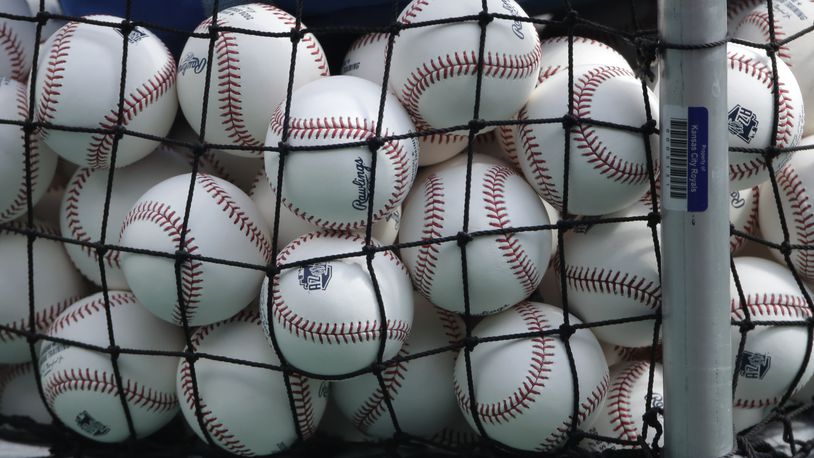 FILE - In this July 3, 2020, file photo, balls marked with Cactus League spring training logos are in a basket during Kansas City Royals baseball practice at Kauffman Stadium in Kansas City, Mo. Major League Baseball has slightly deadened its baseballs amid a years-long surge in home runs.
MLB anticipates the changes will be subtle, and a memo to teams last week cites an independent lab that found the new balls will fly 1 to 2 feet shorter on balls hit over 375 feet. (AP Photo/Charlie Riedel, File)
