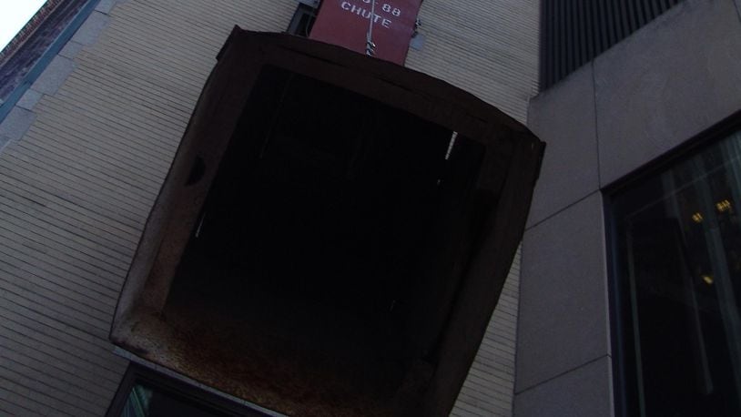 A Denver man was injured after he fell down a trash chute and into a trash compactor.