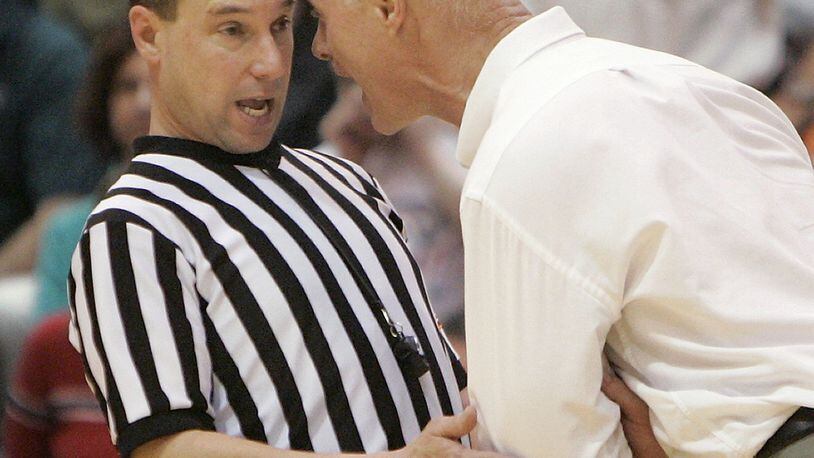 Wisconsin-Green Bay coach Kevin Borseth does not hesitate to let his emotions flow, as this referee found out during the Horizon League tournament. AP photo