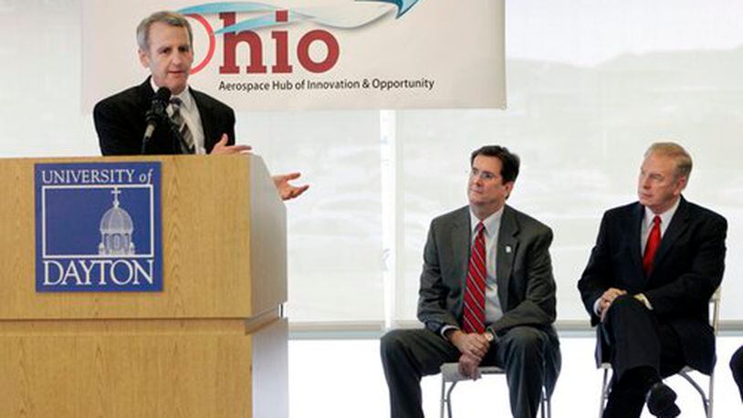 Dan Foley, the Montgomery County Commissioner, with Daniel Curran (center), the Univeristy of Dayton President, and Ohio Governor Ted Strickland in the background, speaks during a an update on the Ohio Hub of Innovation & Opportunity program.