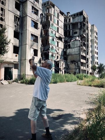 Taking a photo of a destroyed apartment