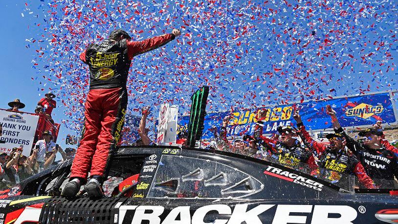 NASCAR driver Martin Truex Jr. (78) faces his teammates as he celebrates in the winner's circle after winning the Toyota/Save Mart 350 at Sonoma Raceway in Sonoma, Calif., on Sunday, June 24, 2018. One of Truex Jr.'s sponsors, 5-hour ENERGY, will not be returning after the 2018 season and is leaving NASCAR altogether. (Jose Carlos Fajardo/Bay Area News Group/TNS)