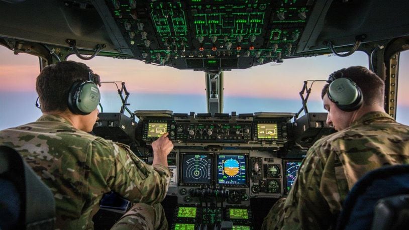U.S. Air Force Capt. Christian Picotte (left) and Maj. Lamb, C-17 Globemaster III pilots assigned to the 816th Expeditionary Airlift Squadron, transport troops and equipment between forward operating locations in the U.S. Central Command area of responsibility, Jan. 25, 2018. The C-17 is not only proficient of transport of troops and cargo but can perform tactical airlift and airdrop missions and transport ambulatory patients during aeromedical evacuations. (U.S. Air National Guard photo/Staff Sgt. Patrick Evenson)