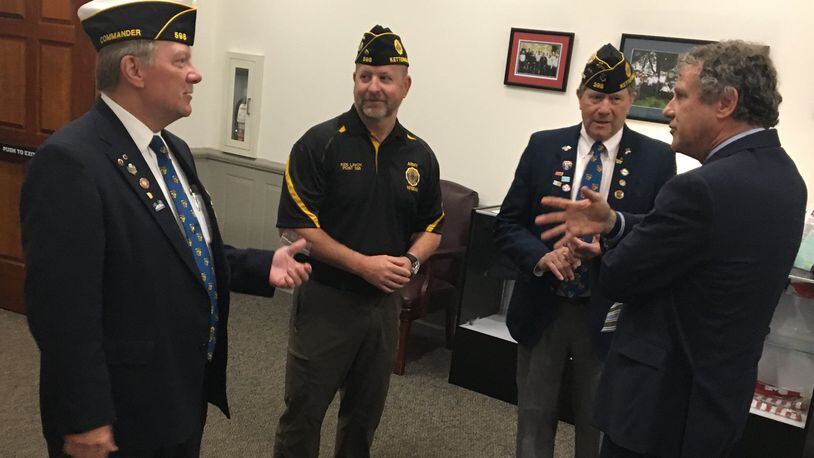 Sen. Sherrod Brown, D-Ohio, speaks with veterans at American Legion Post 598 in Kettering. Brown was in the area this week to drum up support for his bill that would require the federal government to buy American flags that are made only with U.S. materials inside the country.