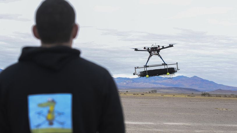 U.S. Air Force 2nd Lt. David Feibus, from Wright-Patterson Air Force Base, Ohio, fly’s one his teams DJI S1000 drone during the setup and calibration phase of the event at the Nevada National Security Site, Las Vegas, NV., Dec. 9, 2016. This year teams were given the challenge of solving issues revolving around drones, and are demonstrating their solutions to judges. (U.S. Air Force photo by Wesley Farnsworth)
