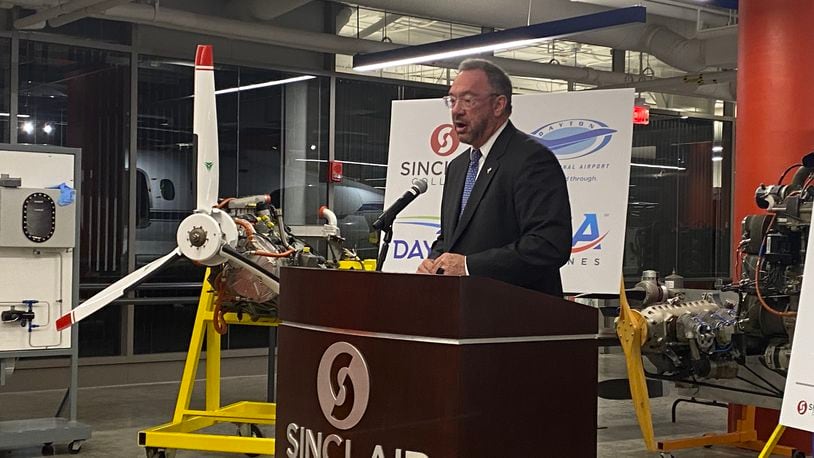 Sinclair Community College president Steve Johnson speaks at an event in December 2021 announcing a new Aircraft Mechanic Training Facility at the Dayton International Airport. Eileen McClory / staff