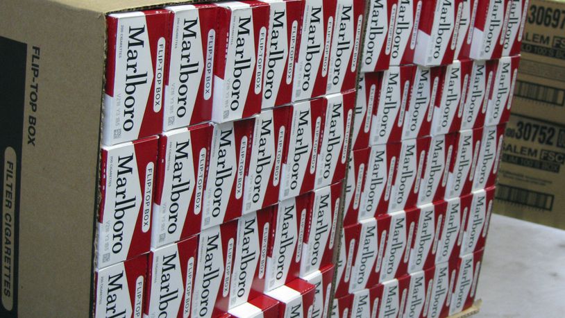 This July 29, 2013, photo shows a case of freshly-stamped Marlboro cigarette cartons at M. Amundson Cigar & Candy Co. in Minneapolis. Smokers in Minneapolis will pay some of the highest cigarette prices in the country after the City Council voted unanimously Thursday, april 25, 2024 to impose a minimum retail price of $15 per pack to promote public health. (Mark Zdechlik/Minnesota Public Radio via AP, file)