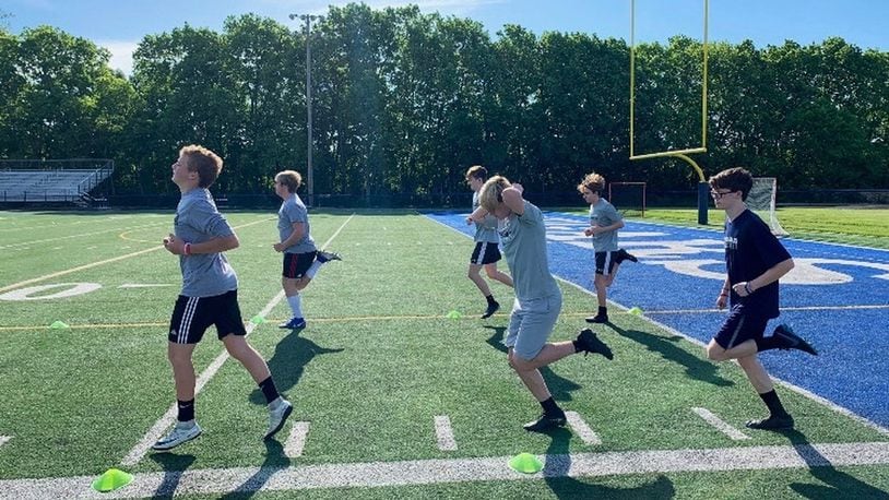 Soccer players at Edgewood High School run on the turf on Tuesday, June 2, 2020, in Trenton. Photo by Greg Brown