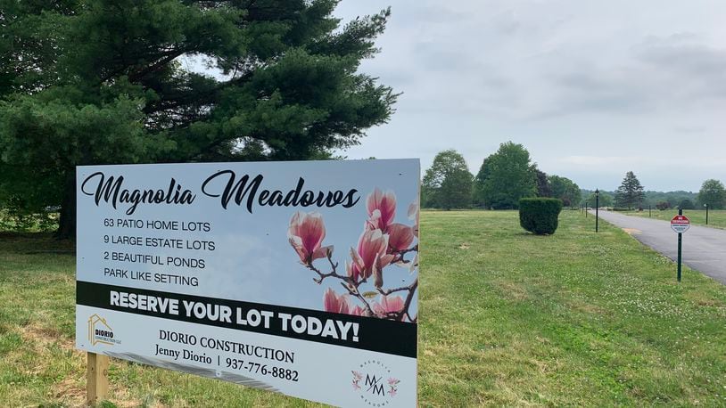 A sign for Magnolia Meadows, one of the most recent developments approved in Sugarcreek Twp, broke ground earlier this year. LONDON BISHOP/STAFF