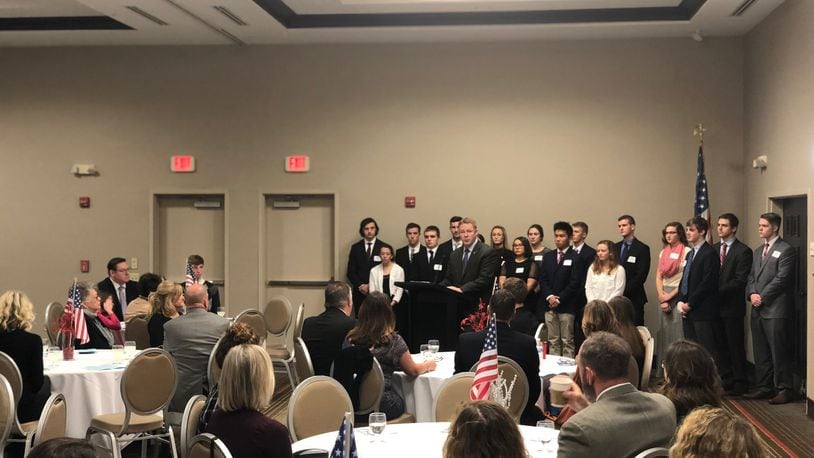 U.S. Rep. Warren Davidson, R-Troy, stands with U.S. Service Academy nominees during a reception in Miamisburg on Sunday
