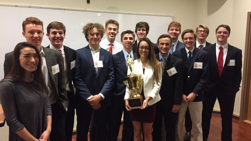 These Oakwood High School students know how to pick winning stocks: (from left) Lily Banke, Aidan Hand, Tommy Lunne, Robin Frejborg, Andrew Varley, Jake Sargent, Kurt Ackerman, Ava Millard, Jack Henry, Carter Winch, Jack Danis, JV Bozell and Josh Leasure. (Not pictured: Abbey Randall and Max Diodoardo.) CONTRIBUTED
