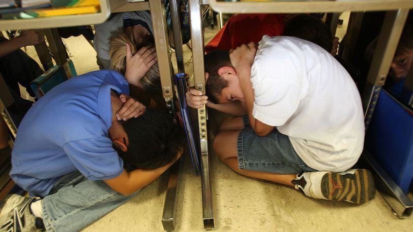 Elementary school children in California practice an earthquake drill at school by dropping, covering and holding in the event of a catastrophic quake. Children in parts of the central U.S. may need to add quake drills to the common tornado drills, as well, with an uptick in human-induced earthquakes in the region.