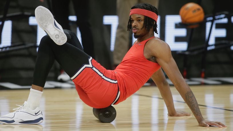Dayton's DaRon Holmes stretches during pregame warmups before a game against Arizona in the second round of the NCAA tournament on Saturday, March 23, 2024, at the Delta Center in Salt Lake City, Utah. David Jablonski/Staff