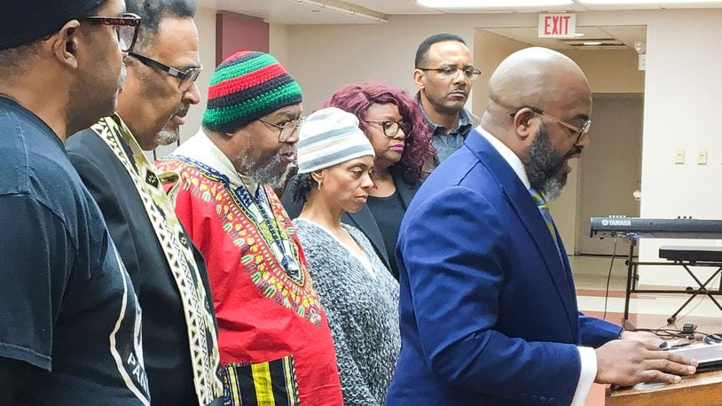 The Rev. Chad White, right, and other leaders of community organizations called Monday for a series of town hall meetings and a peaceful protest to counter a planned May rally in Dayton by a Ku Klux Klan group. CHRIS STEWART / STAFF