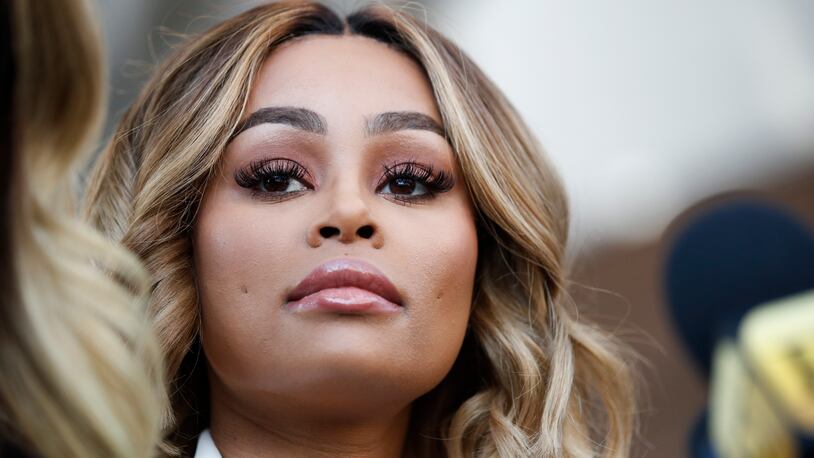 Rob Kardashian's ex-fiancee Blac Chyna listens to her attorney Lisa Bloom at a news conference after a hearing Monday, July 10, 2017, in Los Angeles. A court commissioner granted Chyna a temporary restraining order against the reality television star. (AP Photo/Jae C. Hong)