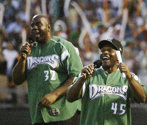 Magic Johnson and Archie Griffin celebrate Dragons