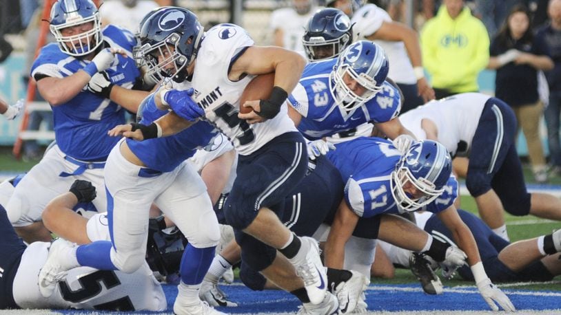 Fairmont’s Jesse Deglow is pursued by Miamisburg’s Cael Parkhurst (43), Dylan Wudke (17) and others. Fairmont defeated host Miamisburg 25-24 in a Week 6 high school football game on Friday, Sept. 28, 2018. MARC PENDLETON / STAFF