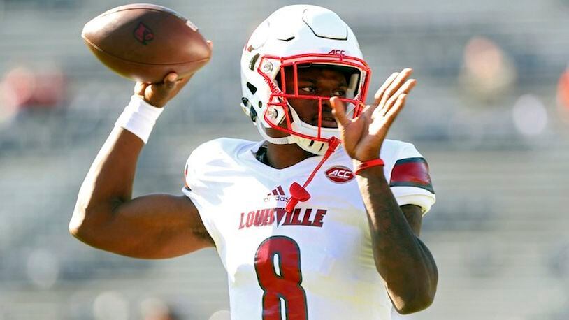 Louisville quarterback Lamar Jackson (8) throws a pass during warmups before an NCAA college football game against Virginia on Saturday, Oct. 29, 2016 in Charlottesville, Va. (AP Photo/Ryan M. Kelly)