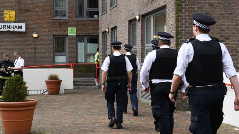 Police officers arrive at Burnham Tower residential block on the Chalcots Estate in north London on Saturday as residents evacuate because of fire safety concerns. 
Residents of 650 London flats were evacuated due to fire safety fears in the wake of the Grenfell Tower tragedy, but 83 people refused to leave their homes, according to local officials. / AFP PHOTO / Justin TALLIS        (Photo credit should read JUSTIN TALLIS/AFP/Getty Images)