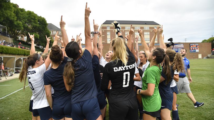 Dayton women's soccer players huddle during a game against Miami in 2019 at Baujan Field. Photo by Erik Schelkun