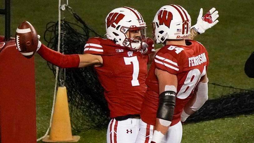 Wisconsin wide receiver Danny Davis III celebrates his touchdown catch with Jake Ferguson (84) during the first half of an NCAA college football game against Illinois Friday, Oct. 23, 2020, in Madison, Wis. (AP Photo/Morry Gash)