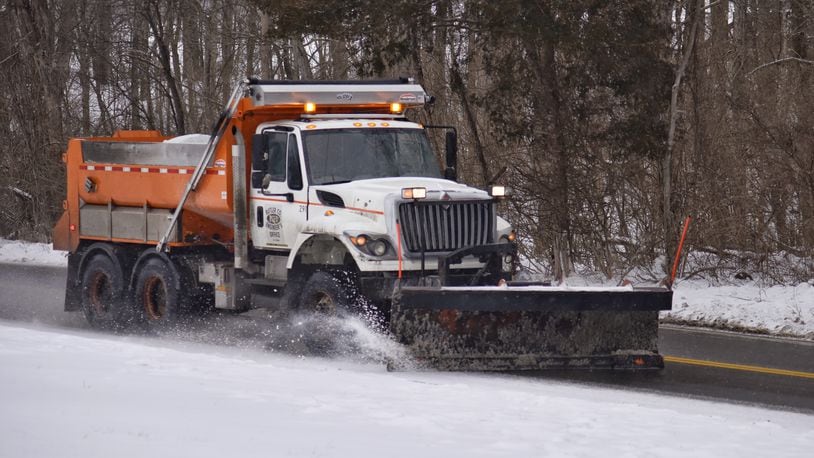 A Butler County Engineer's Office salt truck plows Elk Creek Road in Madison Twp. Monday, February 15, 2021. NICK GRAHAM/FILE