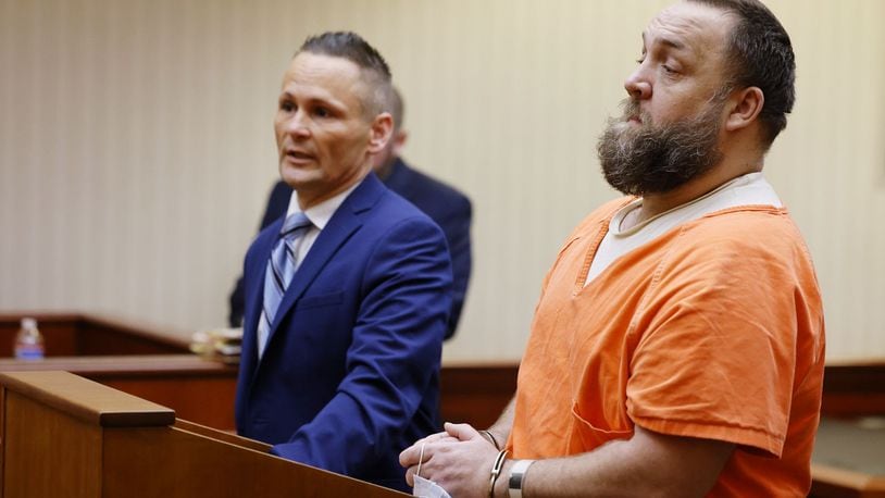 Michael Maloney, right, with attorney Ched Peck, appeared in Butler County Common Pleas Court for a hearing Wednesday, May 25, 2022 on charges in connection with pouring hot oil on a woman and child. NICK GRAHAM/STAFF