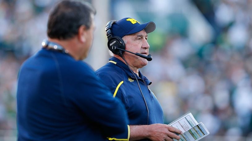 EAST LANSING, MI - OCTOBER 25:  Michigan Wolverines defensive coordinator Greg Mattison watches the action from the sidelines during the second quarter of the game against the Michigan State Spartans at Spartan Stadium on October 25, 2014 in East Lansing, Michigan. The Spartans defeated the Wolverines 35-11.  (Photo by Leon Halip/Getty Images)
