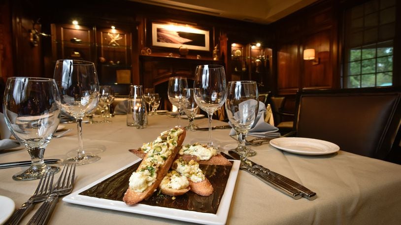 Jag’s Steak and Seafood in West Chester Township has finished a remodel that includes some new food dishes like this Homemade Ricotta Bruschetta with Lemon Marmalade pictured here in the renovated Library room. NICK GRAHAM/STAFF
