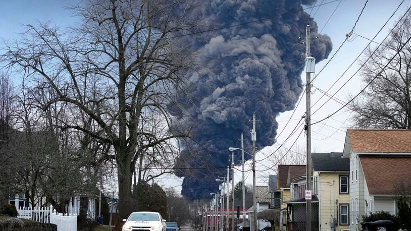 FILE - A black plume rises over East Palestine, Ohio, as a result of a controlled detonation of a portion of the derailed Norfolk Southern trains, Feb. 6, 2023. Residents of eastern Ohio can now get an up-close view in newly released videos of the twin toxic towers of fire that forced them from their homes last February when officials decided to blow open five tank cars filled with vinyl chloride they worried might explode days after a Norfolk Southern train derailed. (AP Photo/Gene J. Puskar, File)