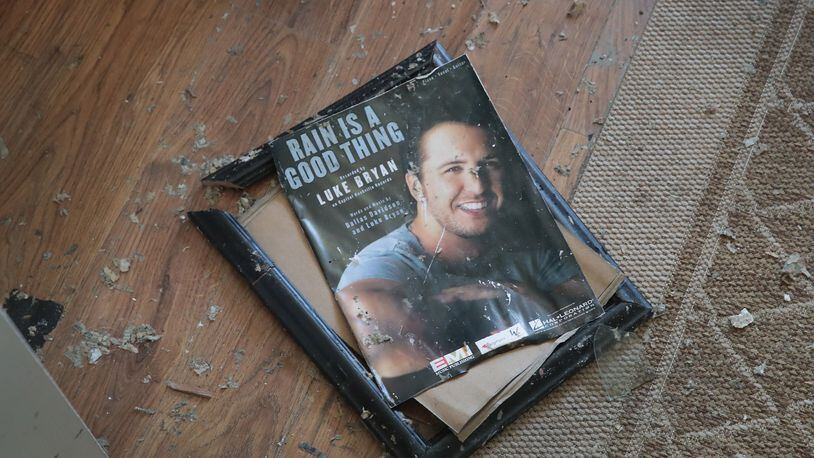 MEXICO BEACH, FL - OCTOBER 19:  A framed momento from her son's music career lays broken on the floor of the home of LeClaire Bryan, mother of country music artist Luke Bryan, after it was severely damaged by Hurricane Michael on October 19, 2018 in Mexico Beach, Florida. Hurricane Michael slammed into the Florida Panhandle on October 10, as a category 4 storm causing massive damage and claiming over 30 lives.  (Photo by Scott Olson/Getty Images)