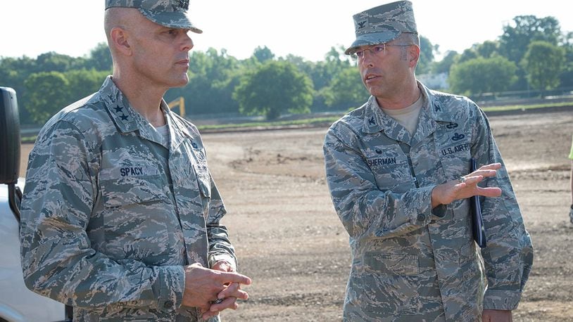 Col. Thomas Sherman, 88th Air Base Wing and Installation commander, talks to Maj. Gen. Bradley D. Spacy, Air Force Installation and Mission Support Center commander, about construction at the new Gate 26A site during the general’s visit to the installation July 12. Spacy received updates on a number of issues being worked on at sites around the base while also getting a chance to meet with Airmen. (U.S. Air Force photo/John Harrington)