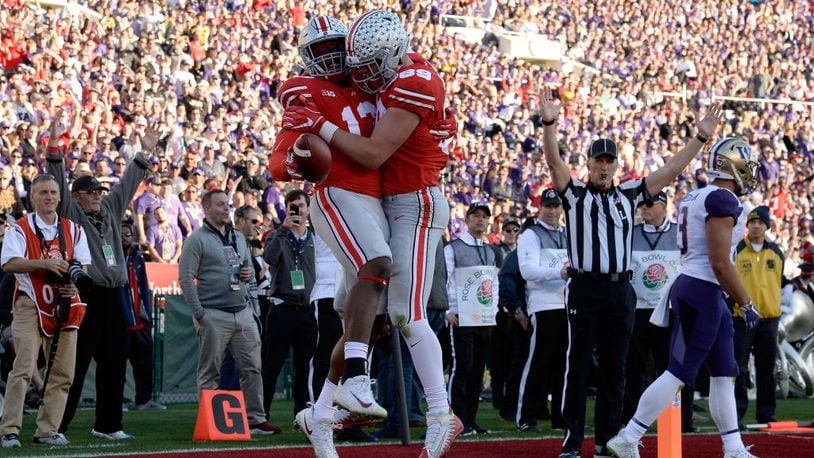 PASADENA, CA - JANUARY 01:  Rashod Berry #13 of the Ohio State Buckeyes and Luke Farrell #89 of the Ohio State Buckeyes celebrate after a touchdown during the first half in the Rose Bowl Game presented by Northwestern Mutual at the Rose Bowl on January 1, 2019 in Pasadena, California.  (Photo by Kevork Djansezian/Getty Images)