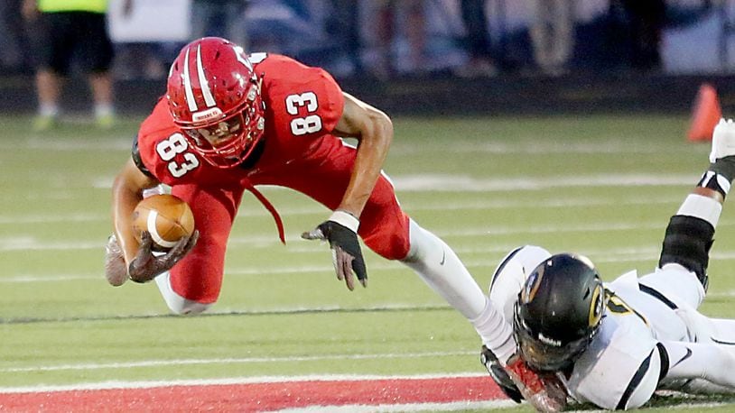 Fairfield tight end Erick All is tripped up by Centerville defensive back Dom Ramsey during Friday’s Skyline Chili Crosstown Showdown contest at Fairfield Stadium. The host Indians lost 30-23. CONTRIBUTED PHOTO BY E.L. HUBBARD