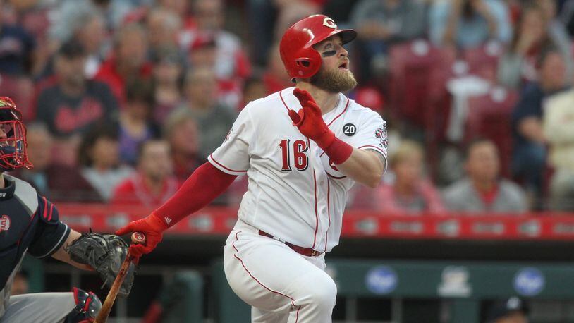 The Reds’ Tucker Barnhart hits a home run in the fourth inning against the Braves on Tuesday, April 23, 2019, at Great American Ball Park in Cincinnati. David Jablonski/Staff