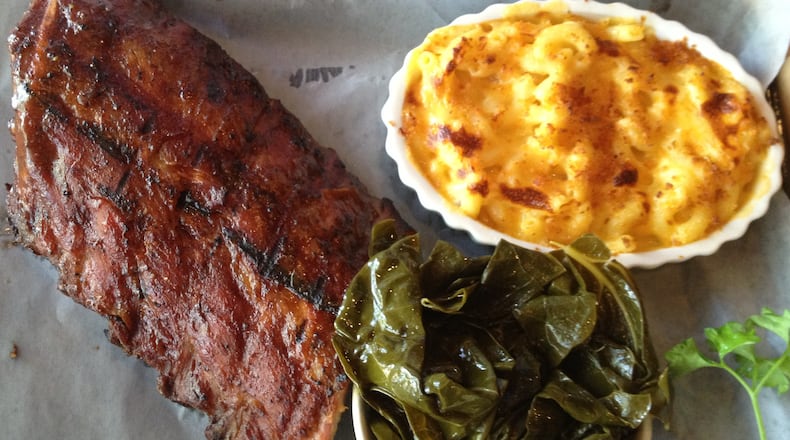 Half slab of baby back rib finished on the grill with a mild Memphis-style sauce. Pictured with collard greens and macaroni and cheese, $16.99. (Staff photo by Amelia Robinson)