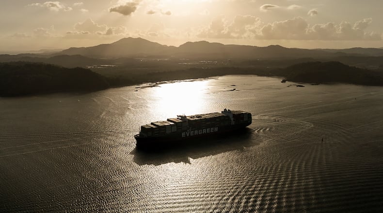A cargo ship transits the Panama Canal in Panama City, Thursday, March 12, 2026. (AP Photo/Matias Delacroix)