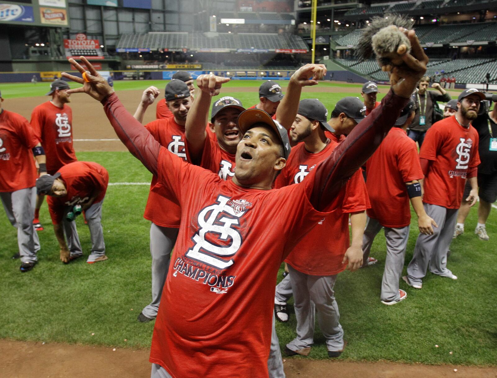 FILE - St. Louis Cardinals' Octavio Dotel celebrates after Game 6 of baseball's National League championship series against the Milwaukee Brewers Sunday, Oct. 16, 2011, in Milwaukee. (AP Photo/David J. Phillip, File)