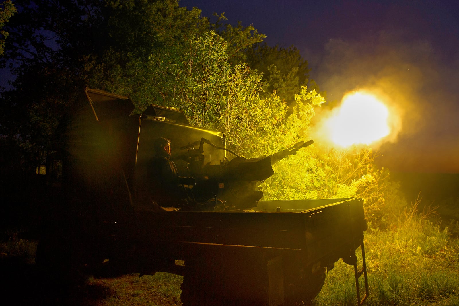 In this photo provided by Ukraine's 127th Separate Brigade of the Territorial Defence press service, soldiers fire during Russian drones attacks near Kharkiv, Ukraine, Saturday, May 24, 2025, (Anatolii Lysianskyi/Ukraine's 127th Separate Brigade via AP)