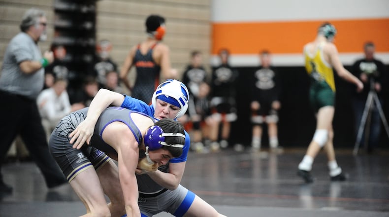 Miami East’s Olivia Shore tries to take down an opponent during a bout earlier this season. Greg Billing/CONTRIBUTED
