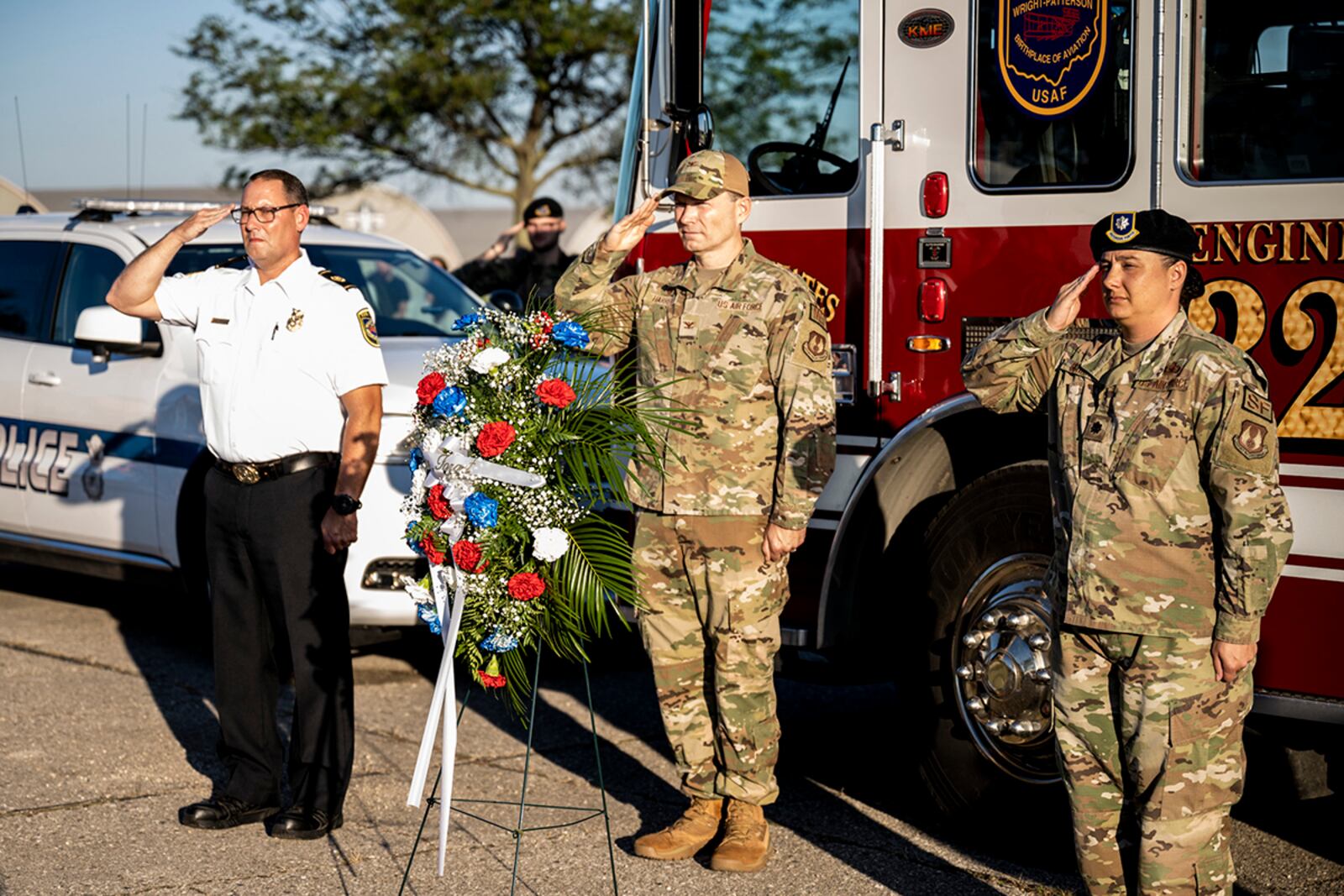 From left: Fire Chief Jacob King, 788th Civil Engineer Squadron; Col. Dale Harrell, 88th Medical Group commander; and Lt. Col. Nicole Schatz, 88th Security Forces Squadron commander, salute after laying a wreath Sept. 9 at Wright-Patterson Air Force Base. The wreath-laying was part of the 9/11 remembrance event that included a memorial run. U.S. AIR FORCE PHOTO/HANNAH CARRANZA