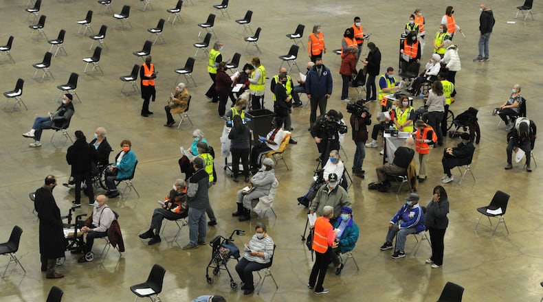 Hundreds of people arrived at the Dayton Convention Center Wednesday morning, Jan. 20, 2021, for the COVID-19 vaccination.